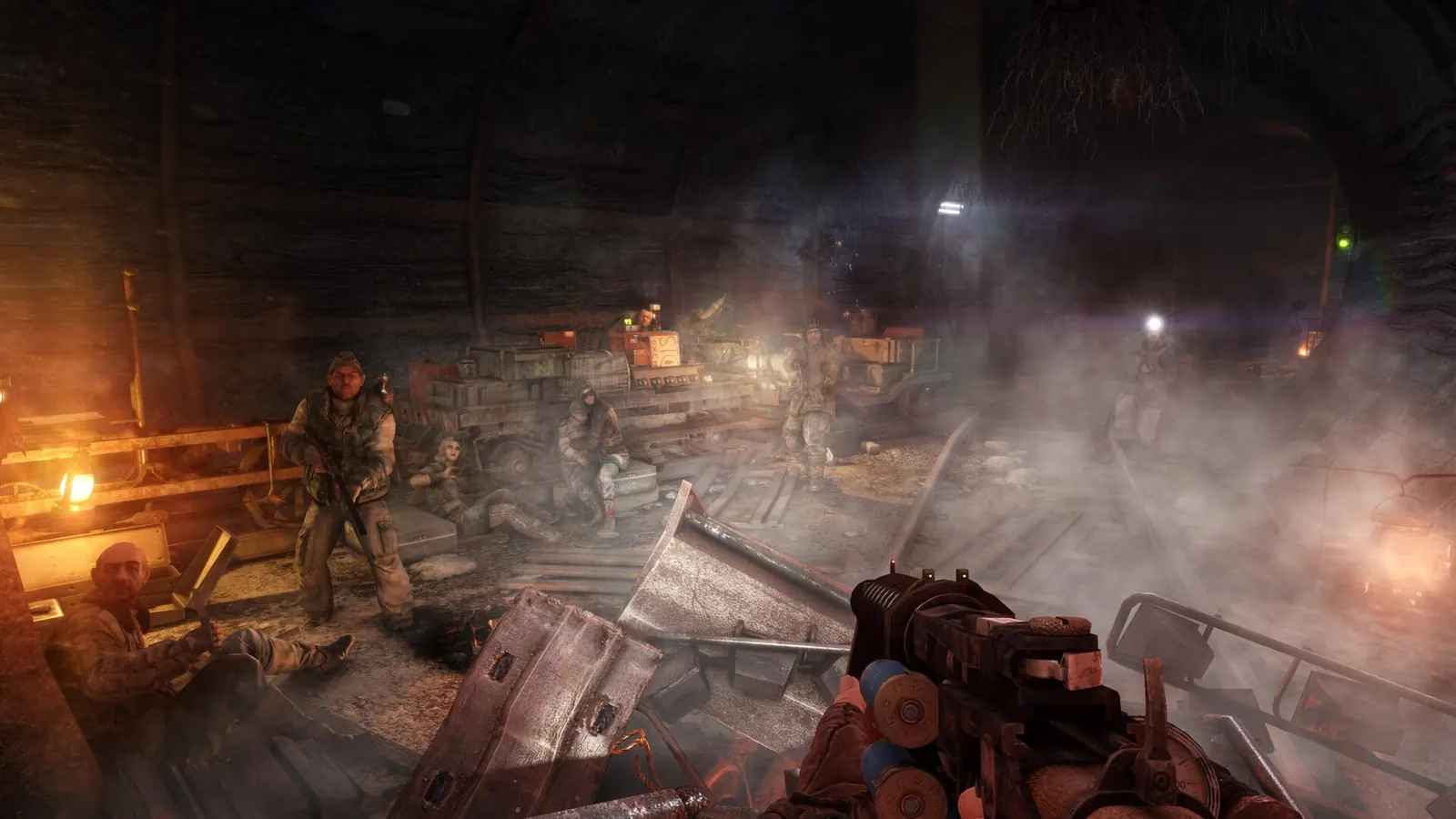 Survivors gather beside railway tracks in a smoky Metro Last Light Redux station
