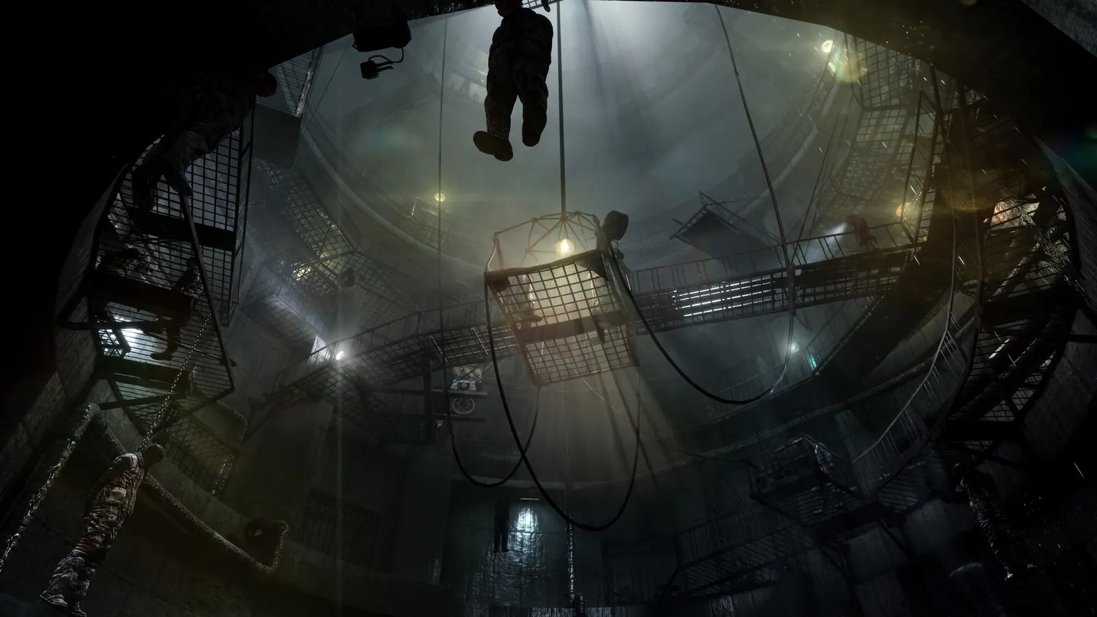 Suspended cages and walkways inside a circular Metro Last Light Redux chamber